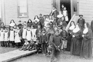 A group of nuns with Aboriginal students, Port Harrison, Quebec, circa 1890.