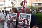 Members of the local Chaldean community gather outside the Patrick V. McNamara Federal Building June 16 to protest the arrest and detention of more than 100 Chaldean Christians from the Detroit area.