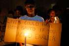 People gather to hold a candle vigil Feb. 2 in Johannesburg for the 94 mentally ill patients who died last year due to negligence.