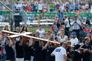  The cross is carried in procession during the Way of the Cross at World Youth Day in Blonia Park in Krakow, Poland, July 29, 2016.
