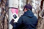 Local resident Dave Brown puts up a makeshift memorial for the community in Portapique, N.S.