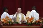 Pope Francis delivers his Easter blessing from the central balcony of St. Peter&#039;s Basilica at the Vatican April 21.