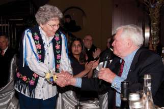John Turner congratulates Sr. Bernadette Gautreau, who was presented with the St. Joseph Award during the Tastes of Heaven gala in 2011.