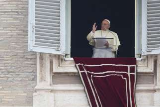 Pope Francis leads the Angelus from the window of his studio overlooking St. Peter&#039;s Square Oct. 22 at the Vatican.